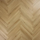 Weathered cedar wood flooring in a herringbone pattern with natural grain texture