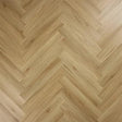 Weathered cedar herringbone flooring with natural wood grain pattern, close-up detail