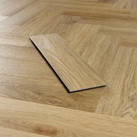 Weathered oak effect vinyl flooring plank on herringbone wood floor background