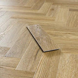 Weathered cedar effect vinyl flooring plank with herringbone pattern close up