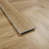 Weathered cedar wood flooring plank close-up on herringbone patterned floor