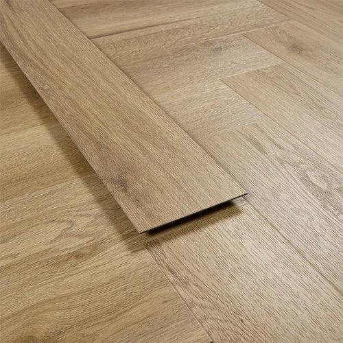 Weathered cedar vinyl flooring plank on herringbone patterned wood-look floor