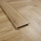Weathered cedar vinyl flooring plank on herringbone patterned wood-look floor