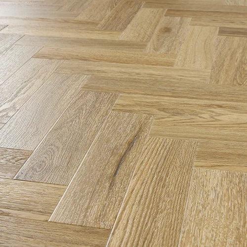 Weathered cedar wood flooring with herringbone pattern and natural grain detail