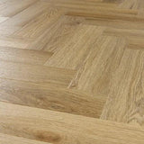 Weathered cedar wooden flooring in herringbone pattern with natural grain detail