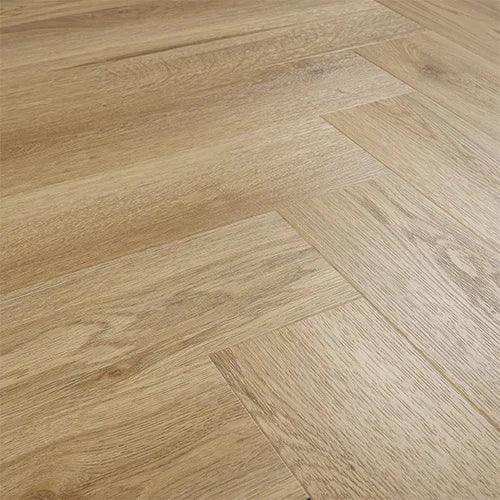 Weathered cedar effect laminate flooring in herringbone pattern, close-up angle