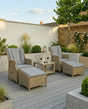 Wentworth recliner chair set with footstools and grey cushions on a modern patio