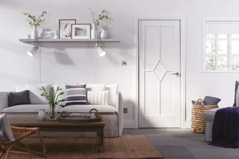 White panel interior door with diamond detail in modern living room with sofa and decor