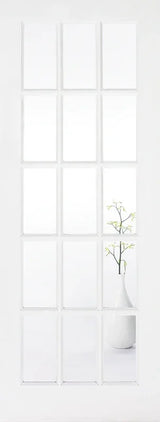 White glazed internal door with 15 glass panels, vase with branches visible through lower pane
