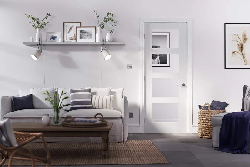 White shaker glazed 4 panel door in modern living room with grey sofa and wooden coffee table