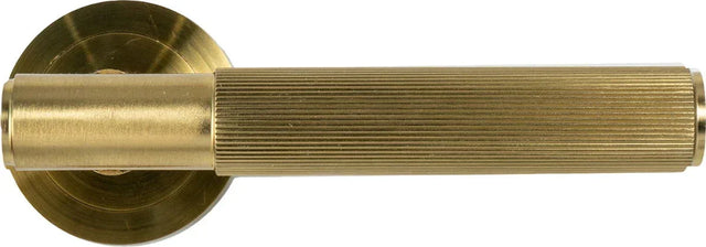 Matt brass door handle with ribbed grip and round rose, modern home hardware