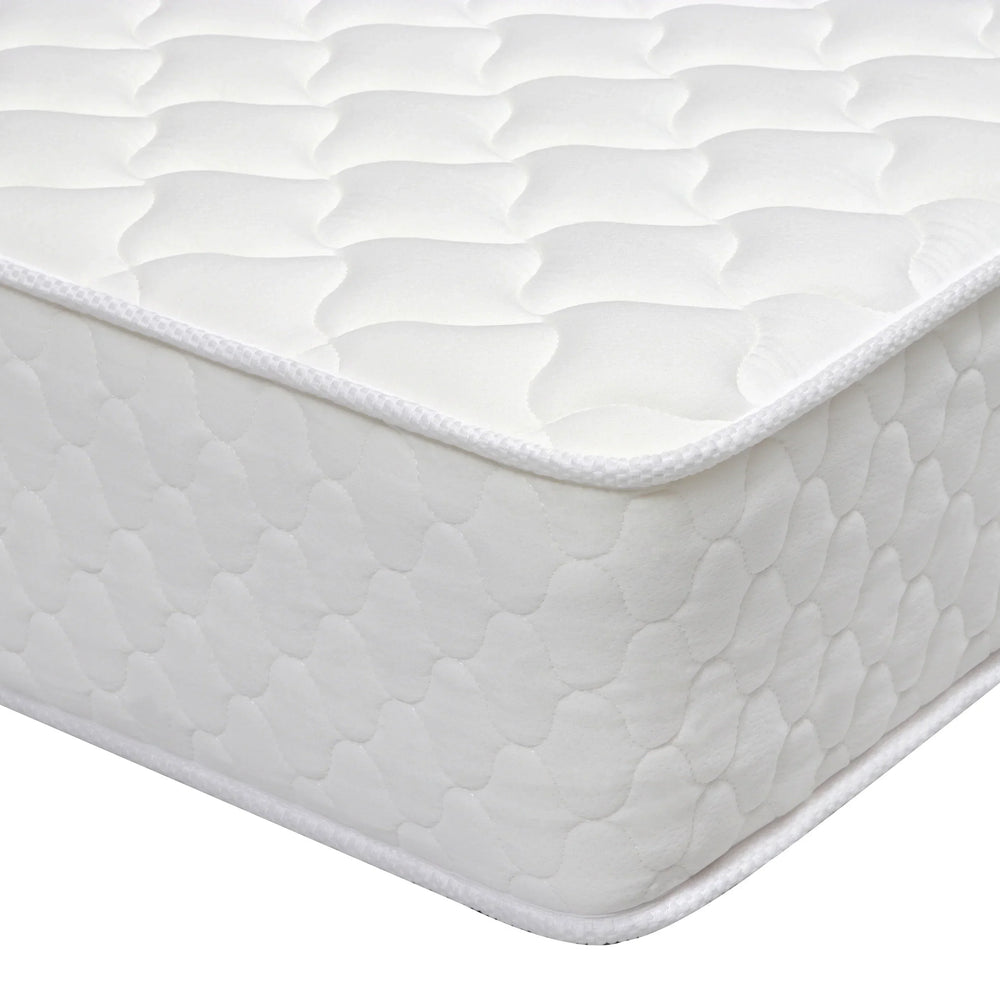 White quilted mattress corner with textured top and stitched edge detail