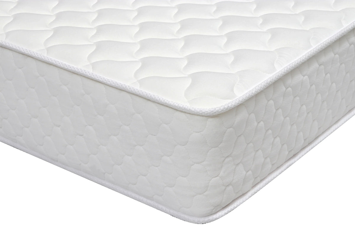 White quilted mattress corner with textured top and stitched edge detail