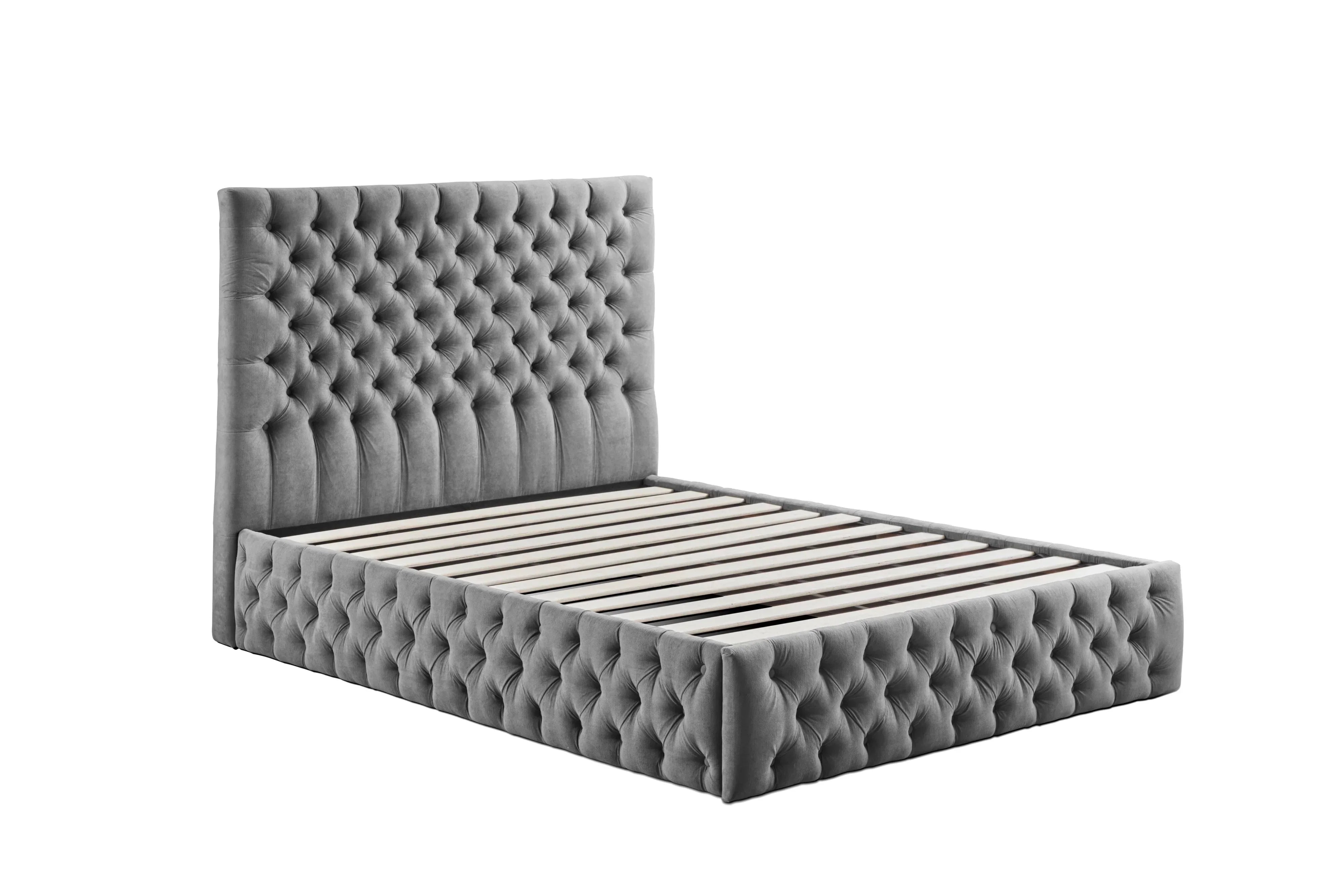 Grey upholstered bed frame with tall tufted headboard and wooden slats