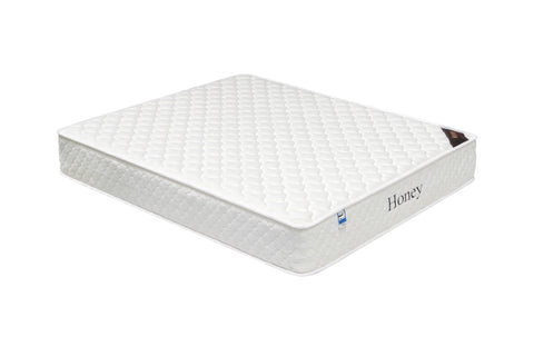 white honey mattress with quilted top and side label, shown at angled view