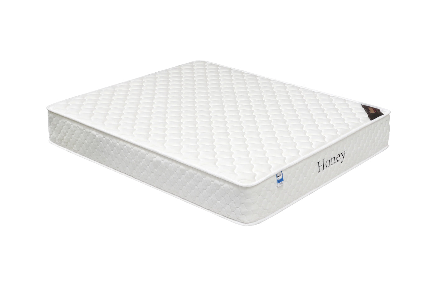 white honey mattress with quilted top and side label, shown at angled view