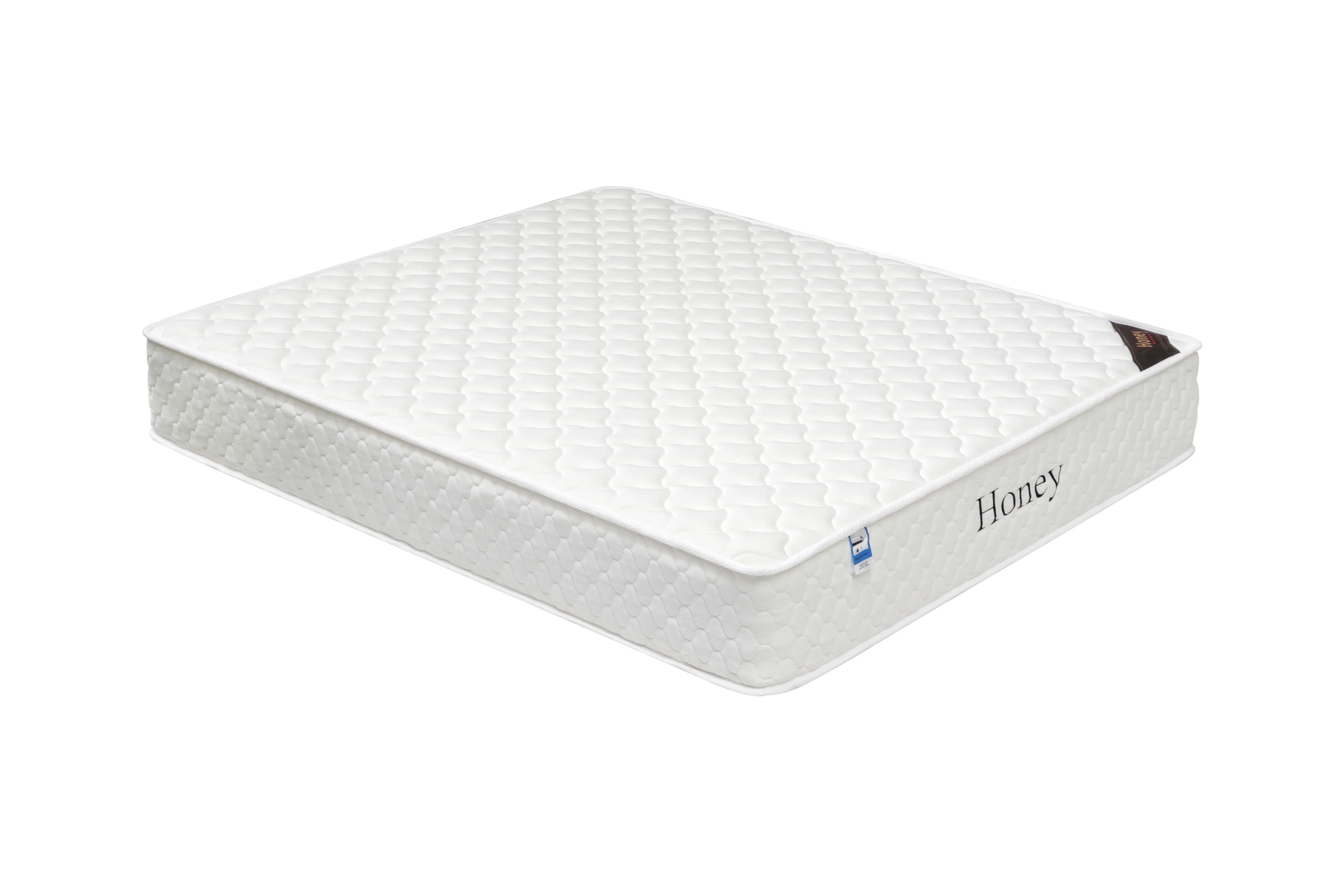 white honey mattress with quilted top and side label, shown at angled view