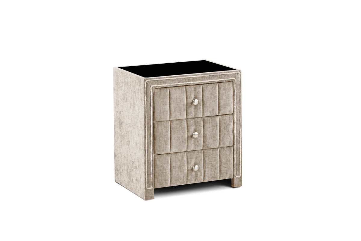 Beige upholstered bedside table with three drawers and textured fabric finish