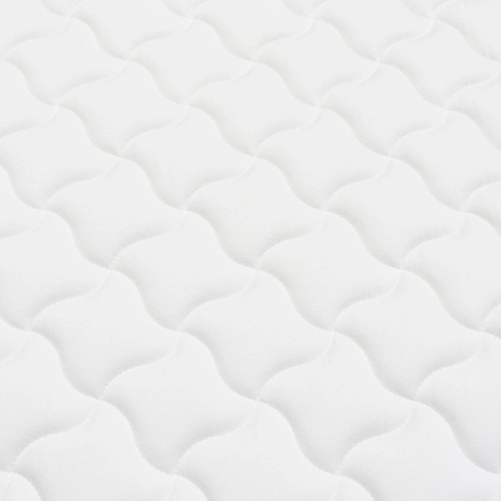 White mattress surface with wave quilted pattern for bedroom furniture