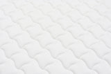 White mattress surface with wave quilted pattern for bedroom furniture