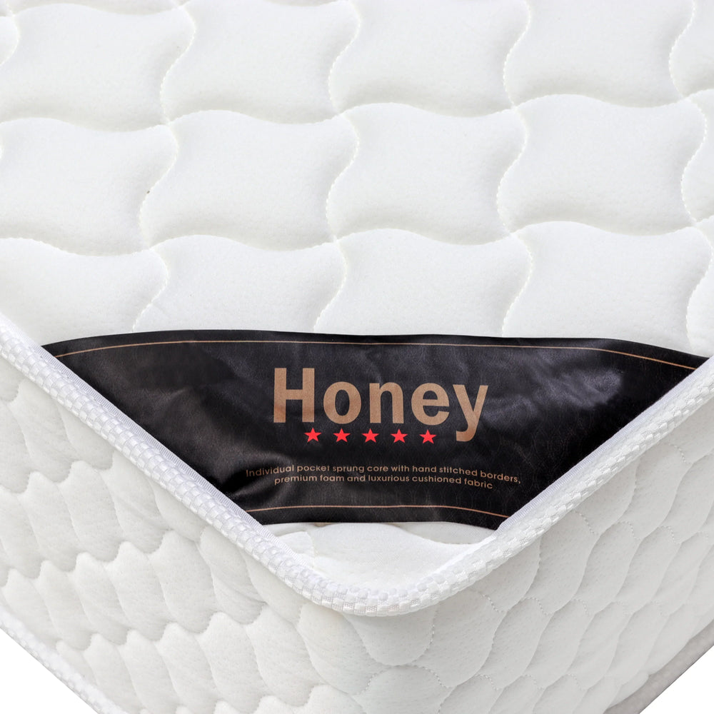 White pocket sprung mattress with quilted top and Honey label on the corner