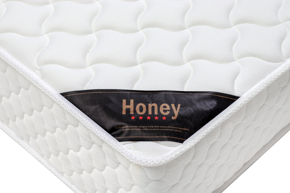 White pocket sprung mattress with quilted top and Honey label on the corner