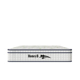 Hybrid mattress with white quilted sides and green pattern top, HoneyB logo at front