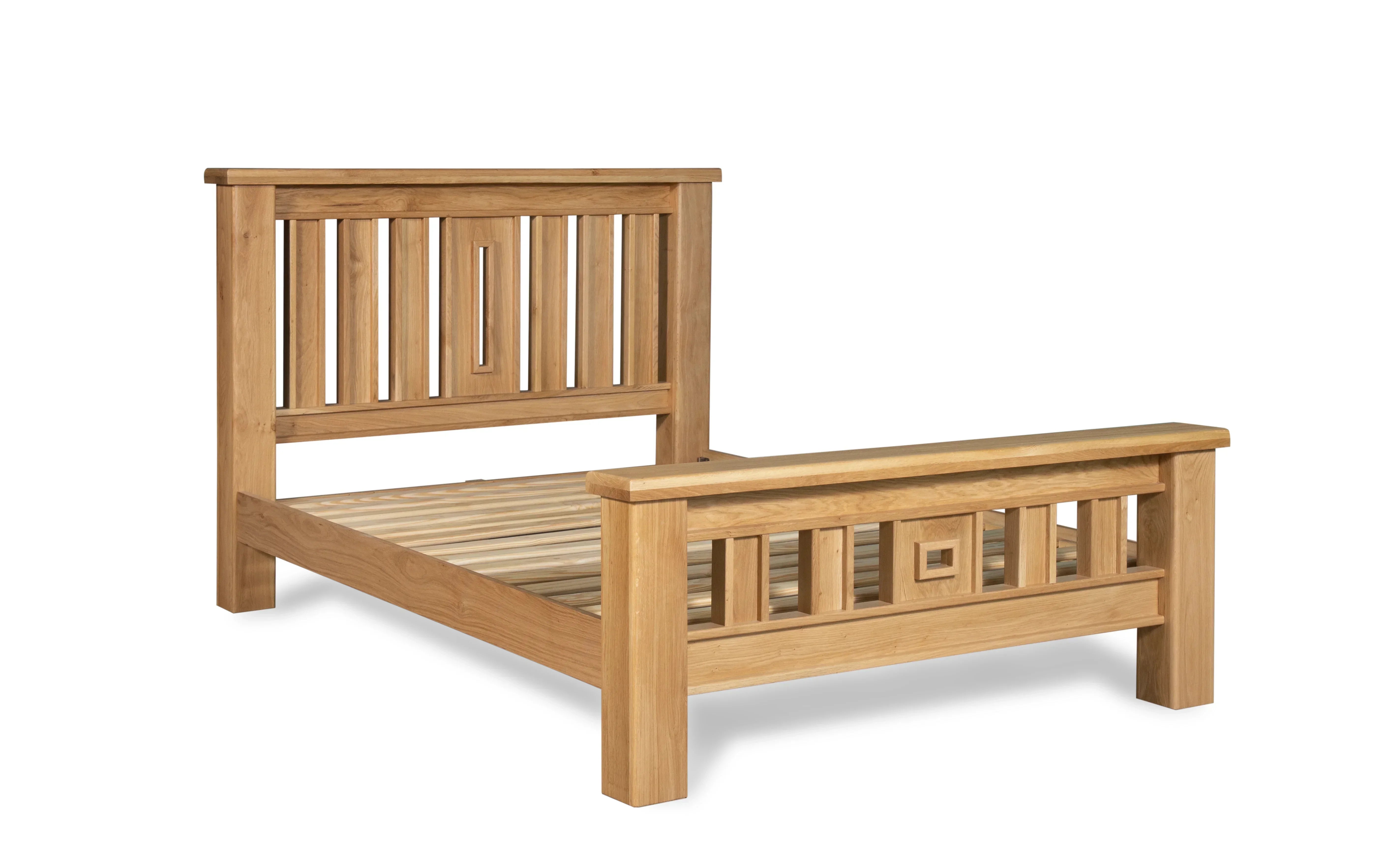 Solid oak bed frame with slatted base and geometric headboard and footboard design