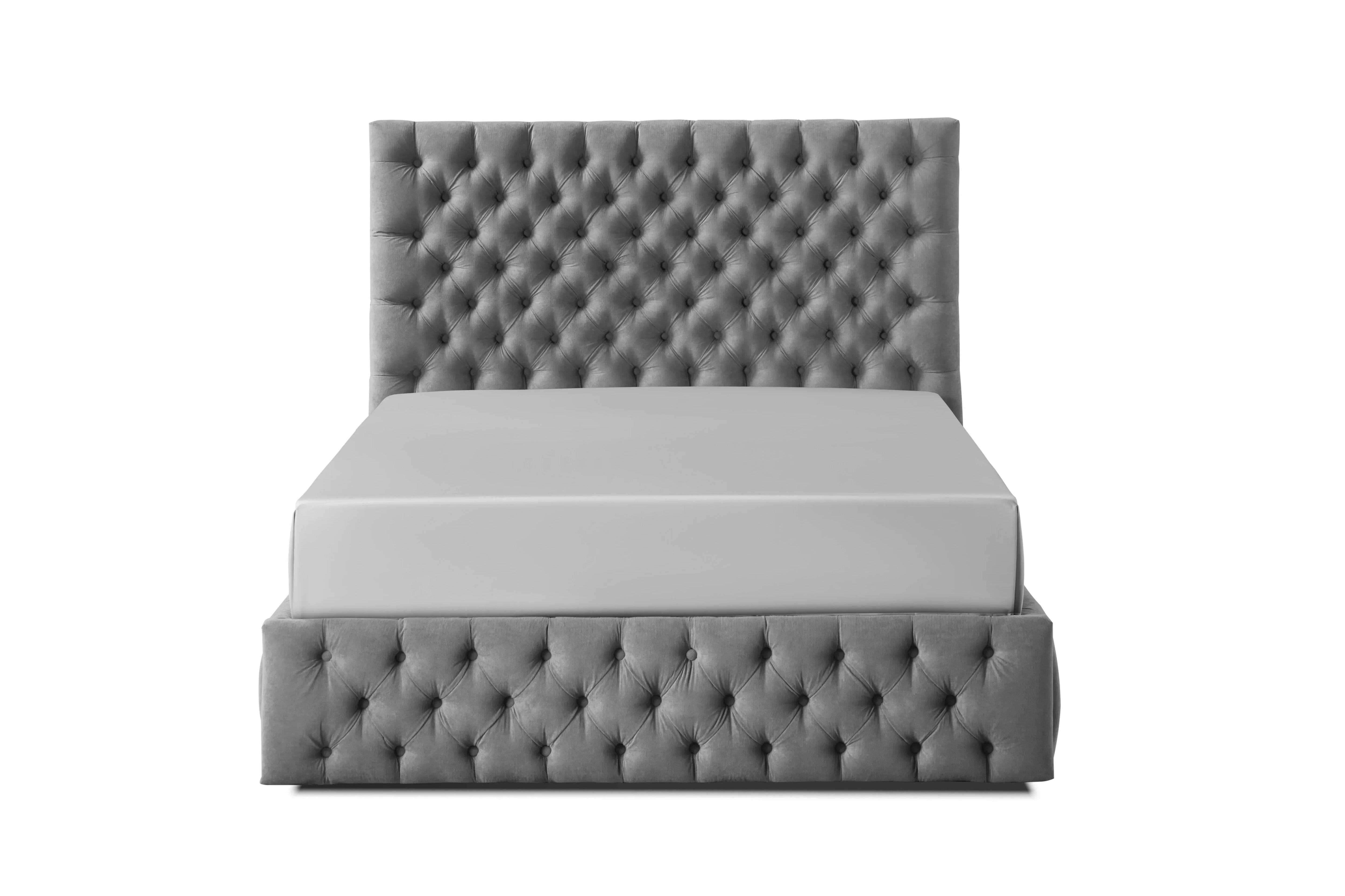 Grey upholstered bed with deep button tufted headboard and base, front view