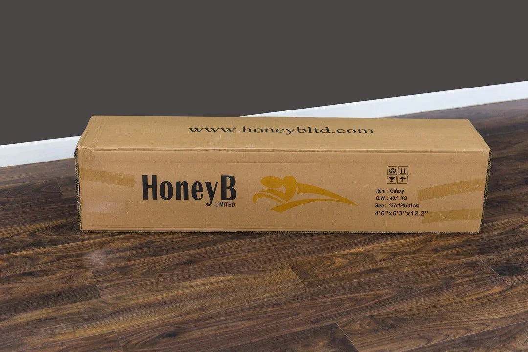 HoneyB bed frame box on wooden flooring with product details and logo visible
