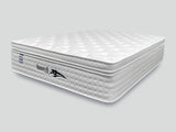 white mattress with quilted top and side logo in showroom style setting