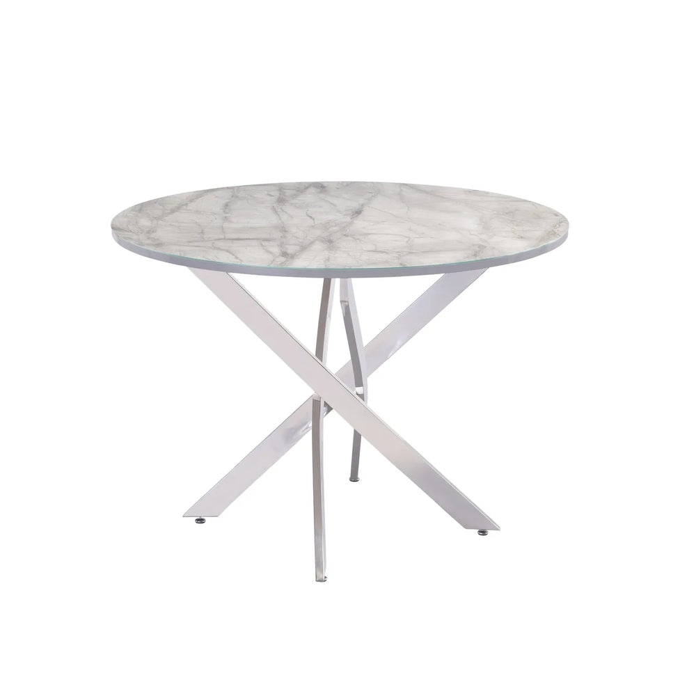 A round dining table with a white and gray marble-patterned top and a silver-finished metal X-shaped pedestal base, shown against a plain white background.