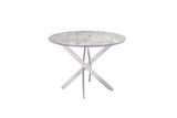 A round dining table with a white and gray marble-patterned top and a silver-finished metal X-shaped pedestal base, shown against a plain white background.