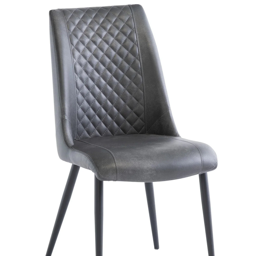 Grey upholstered dining chair with diamond stitching and black metal legs