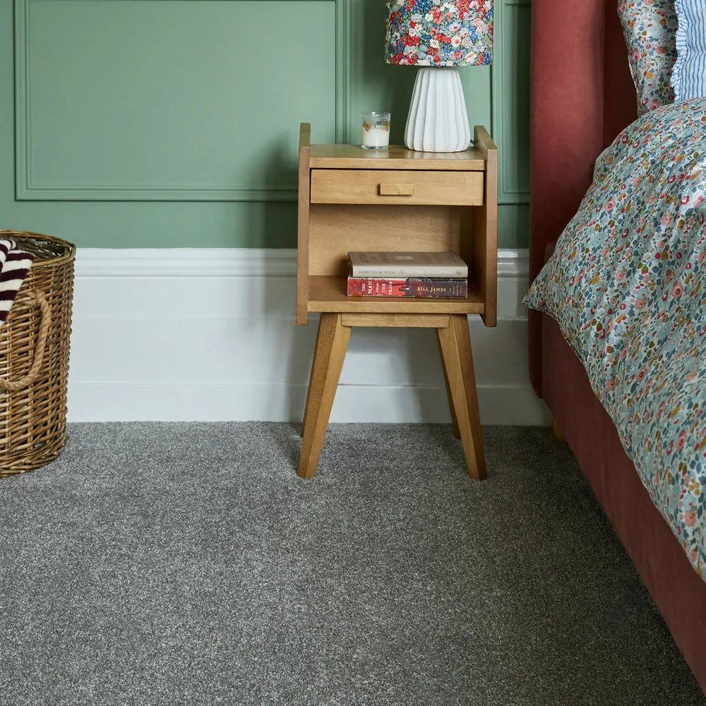 Apollo Elite Coniston Slate grey carpet in modern bedroom with wooden bedside table