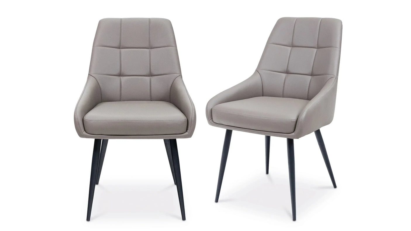 Pair of grey dining chairs with padded upholstery and black legs on white background