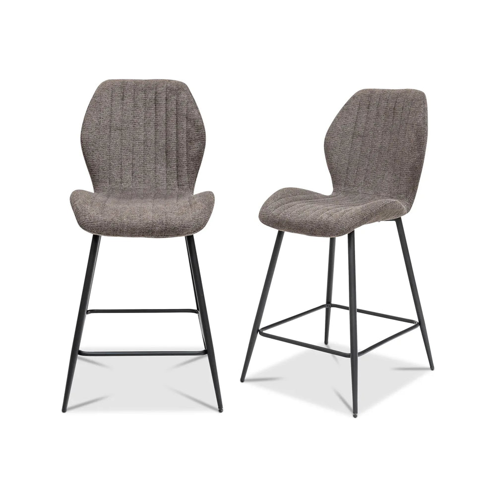 Two gray bar stools with black metal legs on a white background