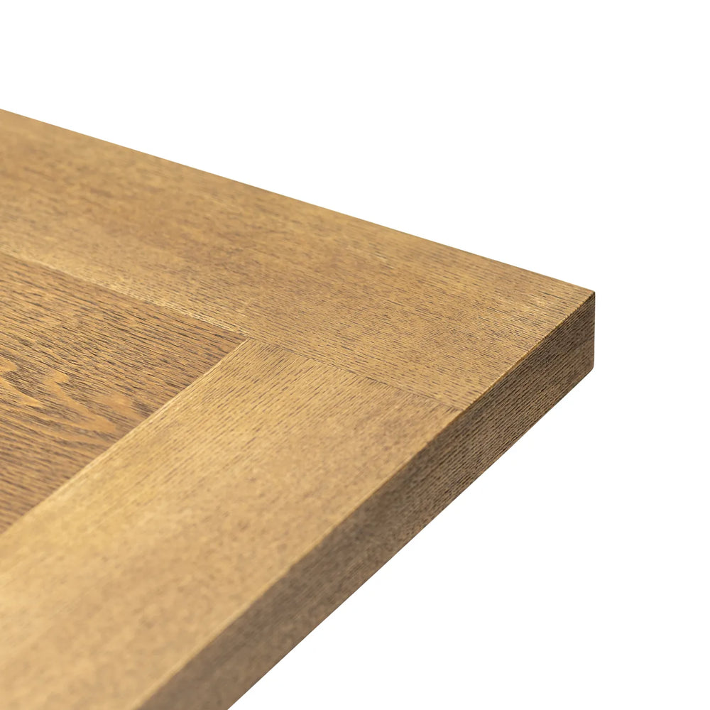 Close-up of a wooden surface with a visible grain pattern on a white background