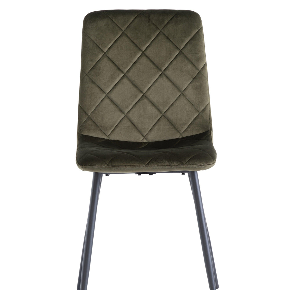 Velvet dining chair with diamond-stitched backrest and black metal legs, front view