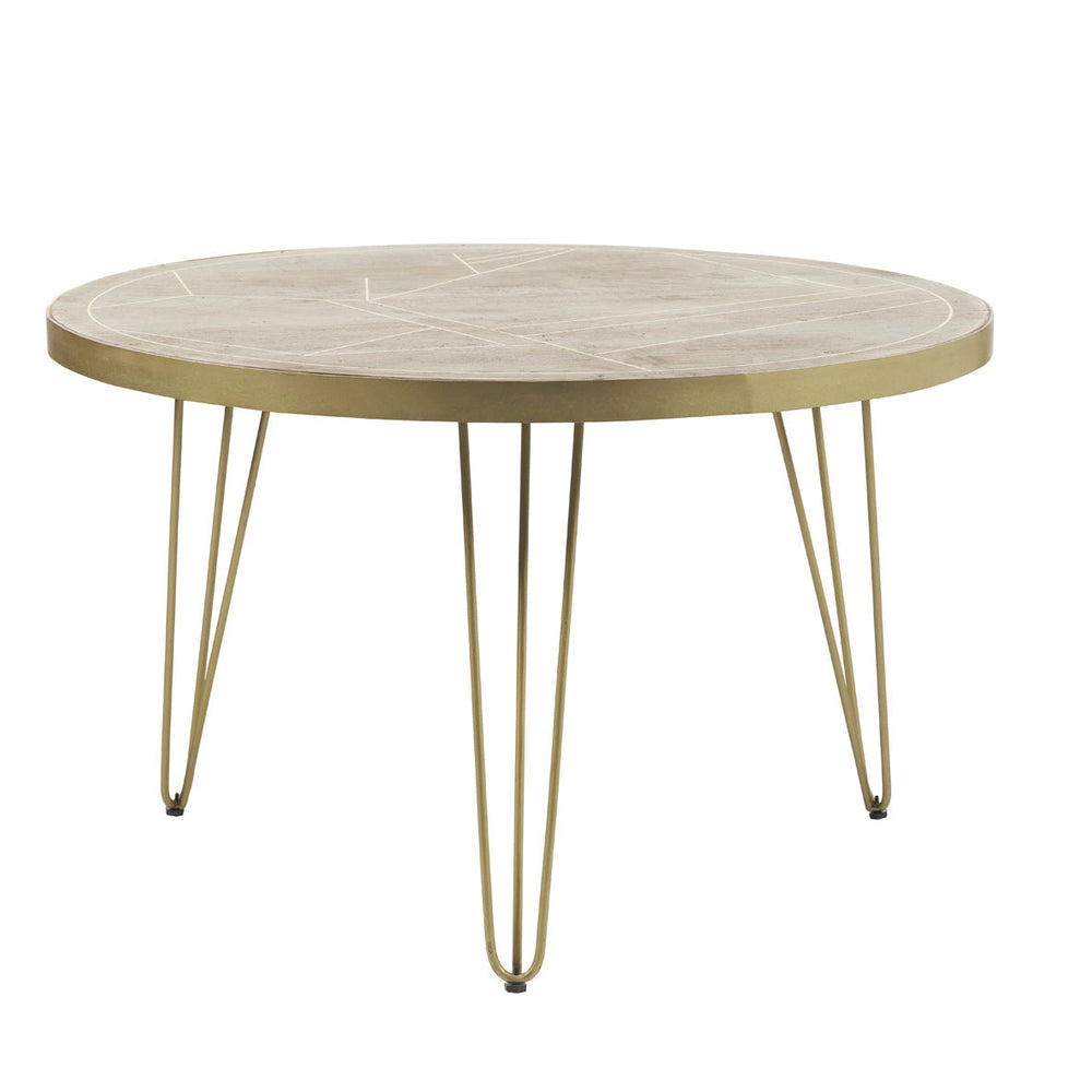 Light gold round dining table with metal inlays and angled legs