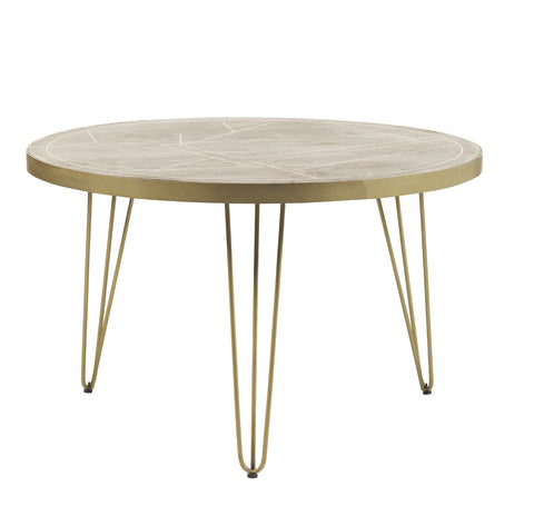 Light gold round dining table with metal inlays and angled legs