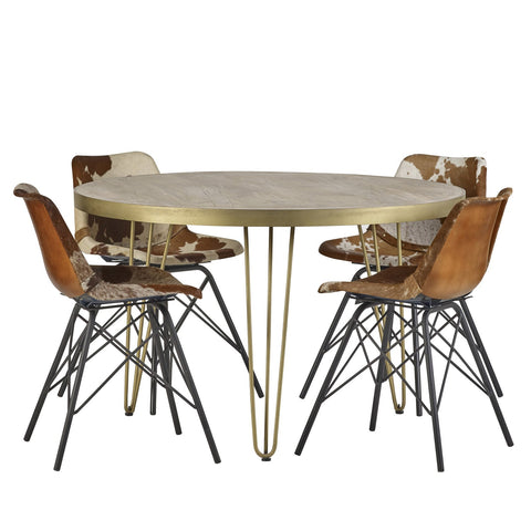 Light gold round dining table with metal inlays and angled legs
