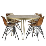 Light gold round dining table with metal inlays and angled legs