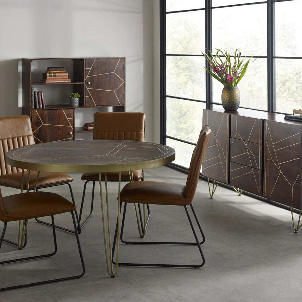 Dark gold round dining table made of solid mango wood with metal inlays