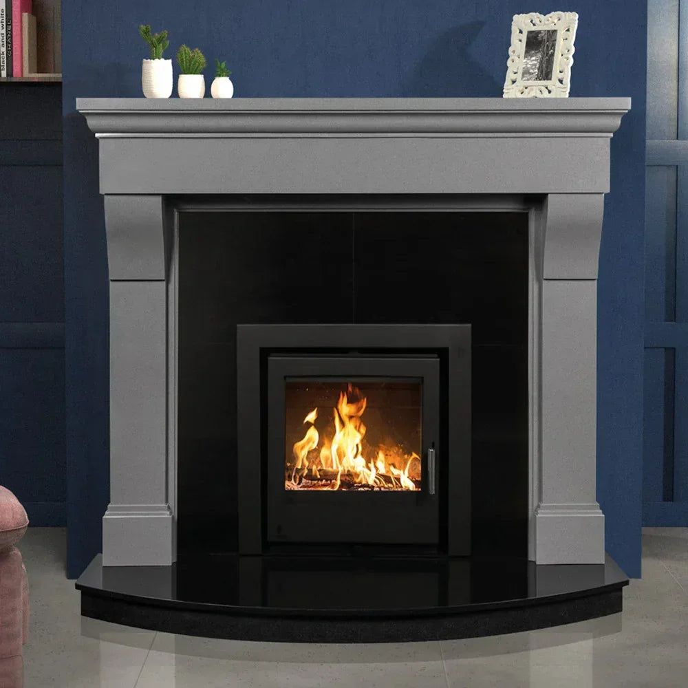 Polished luna grey fireplace surround with black insert, fire burning inside, decorative mantle