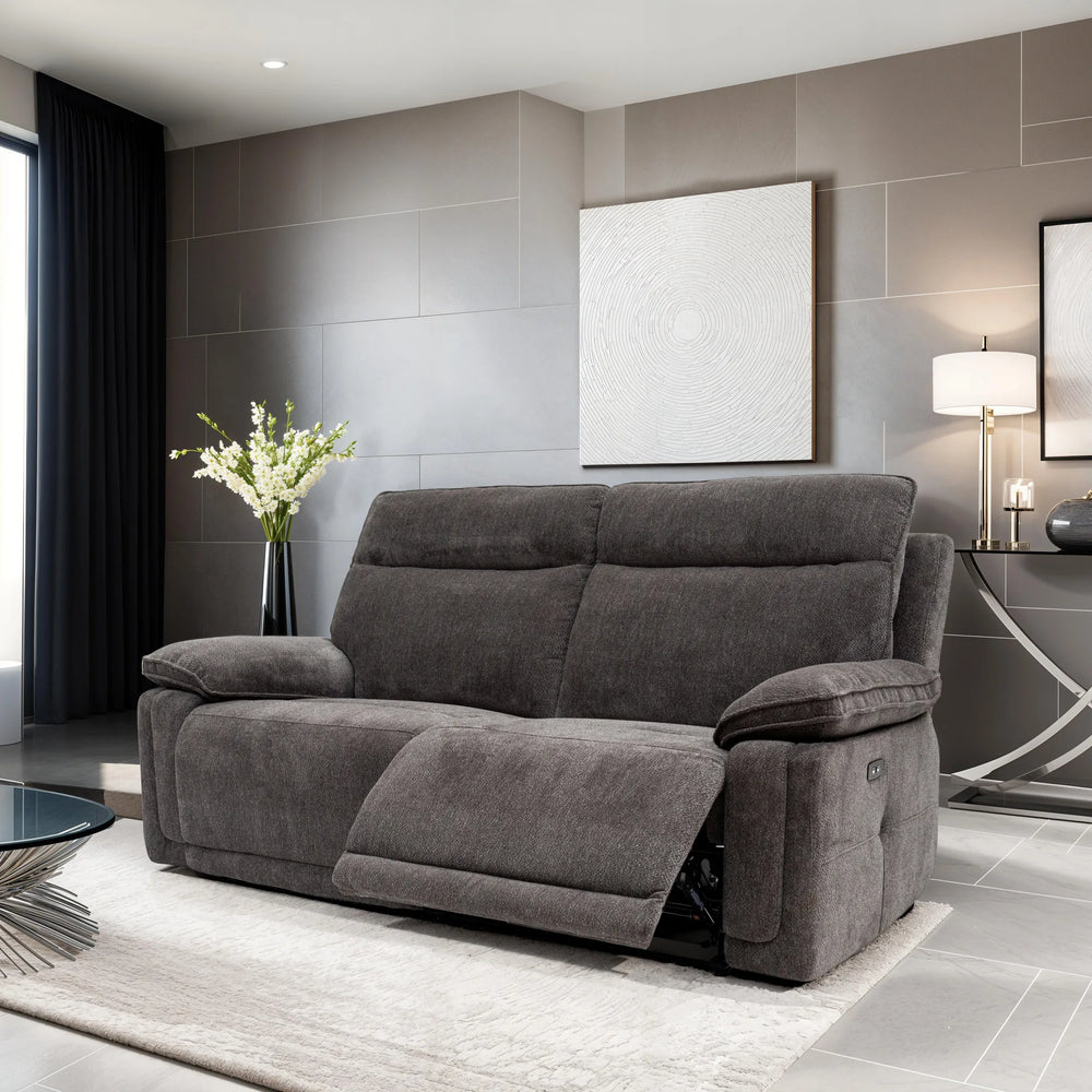 Gray sofa in a modern living room with gray walls and decorative elements.