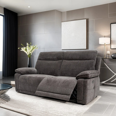 Gray sofa in a modern living room with gray walls and decorative elements.