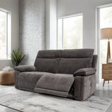Gray sofa in a modern living room with white brick wall and large windows.
