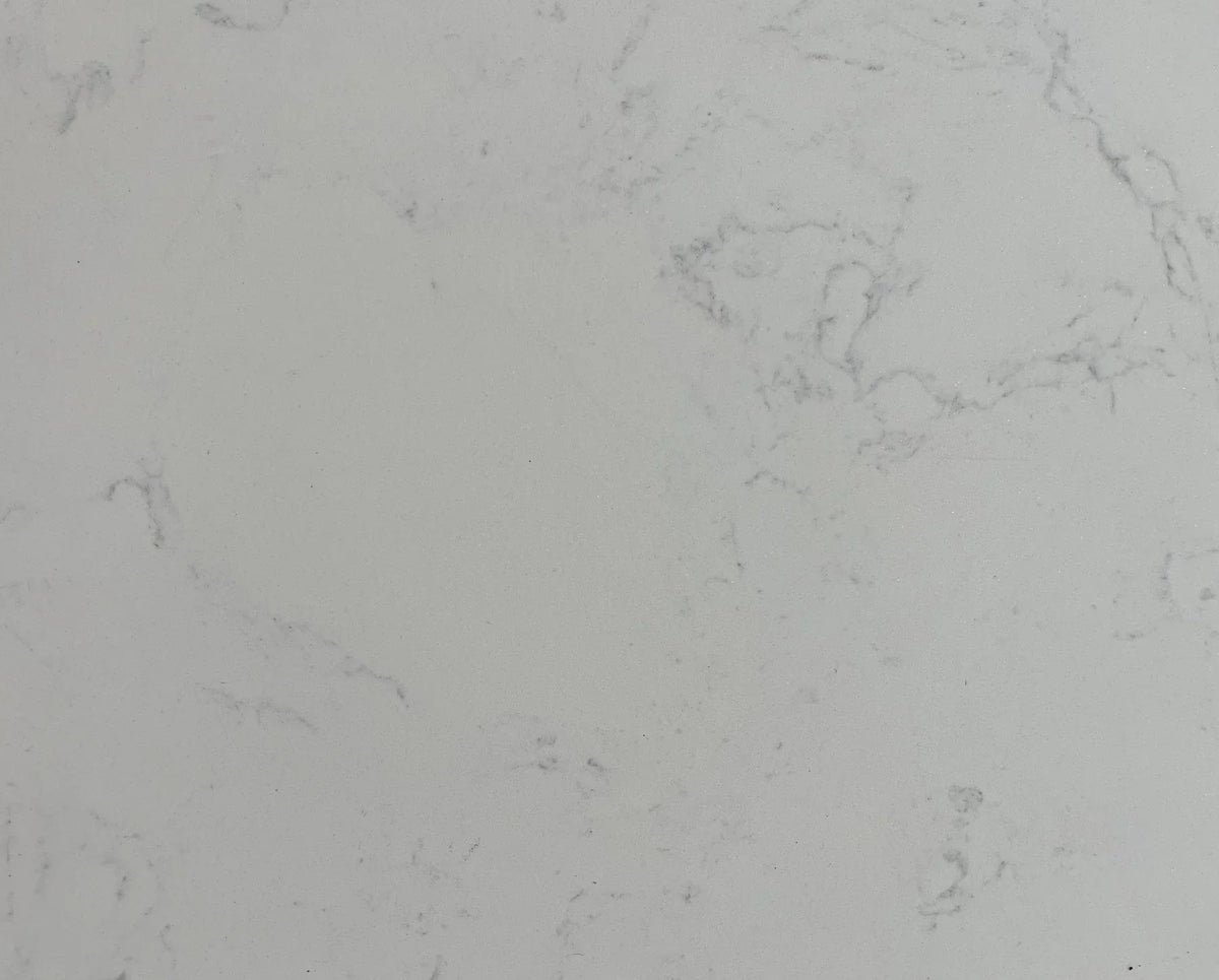 Close-up of white marble tabletop with subtle grey veining pattern