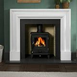 Polished polar white fireplace surround with wood burning stove and dark hearth